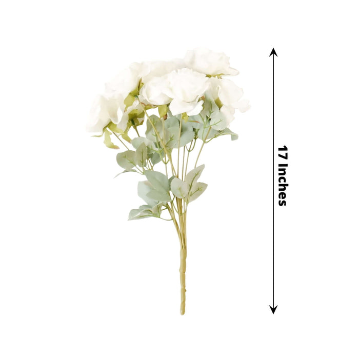 White artificial flower bouquet with green leaves, 17 inches tall.