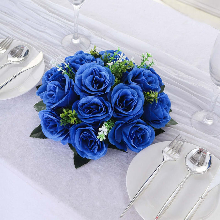 Blue artificial rose centerpiece arrangement for table decor.
