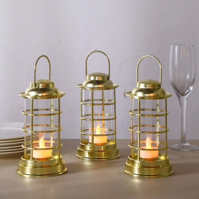 Gold lanterns with candles for decorative ambiance.