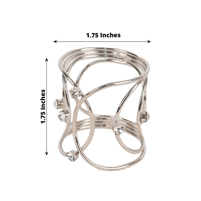 Silver metal ring with crystal accents, 1.75 inches wide.