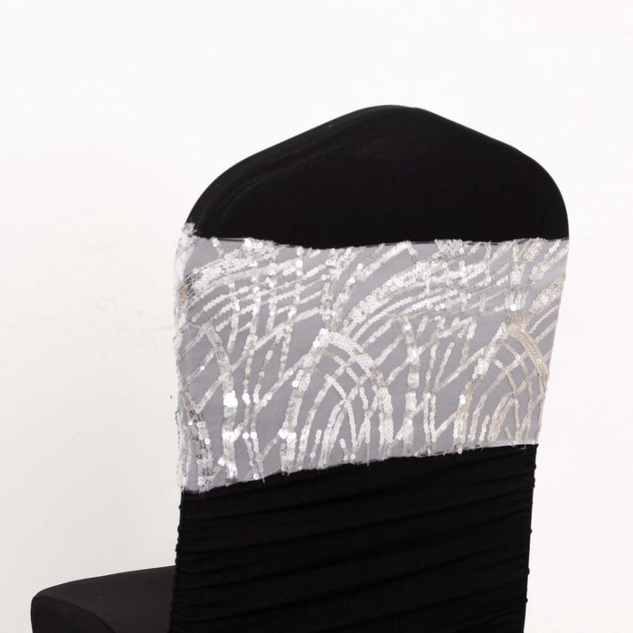 Black chair cover with silver sequin design on the back.
