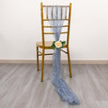 Blue sheer fabric draped on a gold chair with a rose accent.