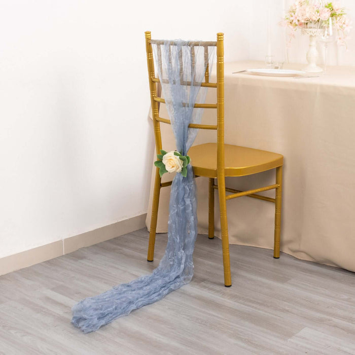 Blue chair sash with a rose, elegantly draped on a gold chiavari chair.