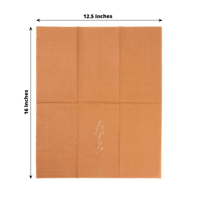 Orange linen placemat with embroidered leaf design, 12.5 x 16 inches.