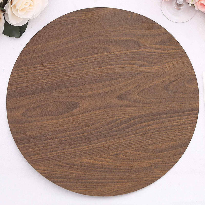 Round wooden serving tray in rich brown finish.