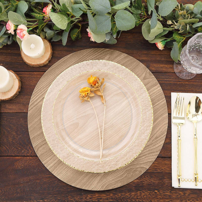 Elegant clear dinner plate with floral accent on a rustic table setting.