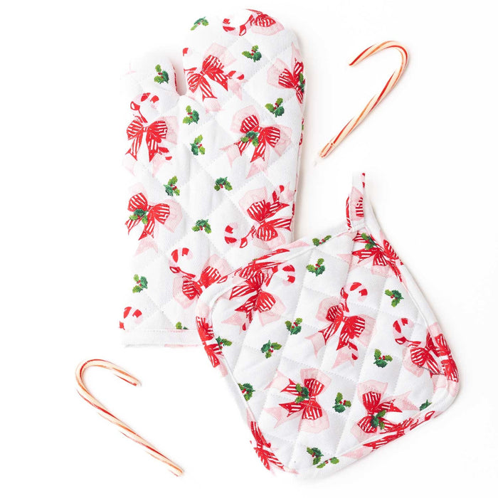Holly Jolly Bows oven mitt set with red bows and holly on white, includes two candy canes