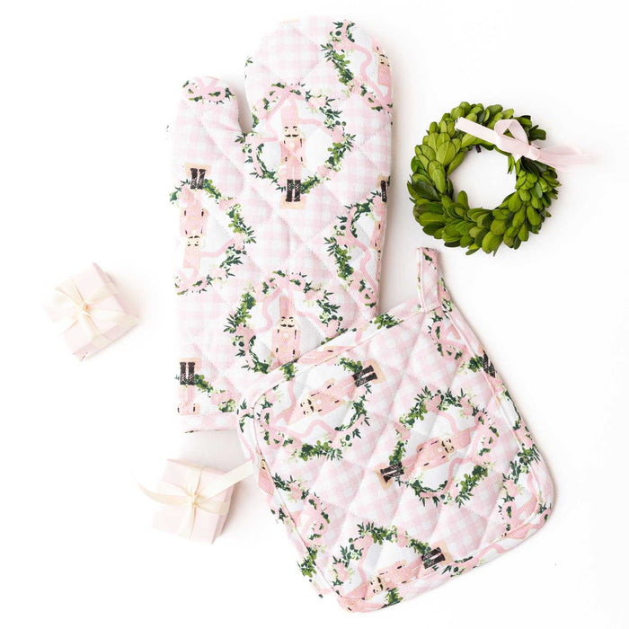 Sugarplum Gingham oven mitt set with pink llama pattern, displayed flat with decorative accessories.