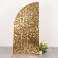 Gold sequin backdrop with floral arrangement