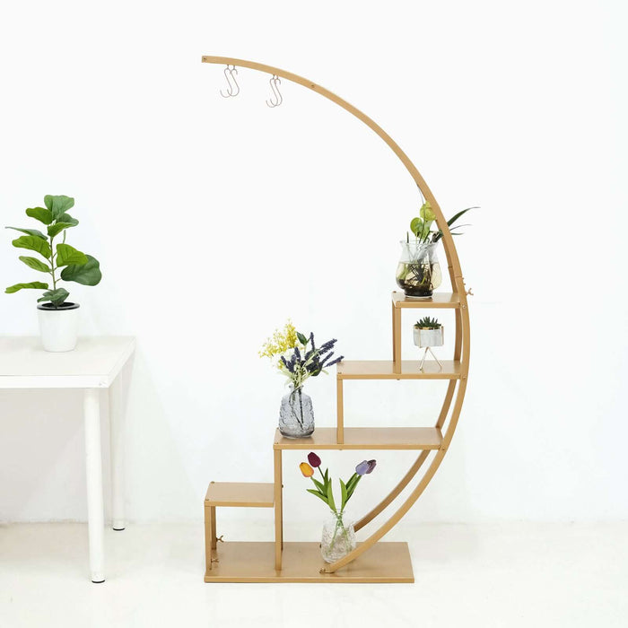 Curved bamboo plant stand with multiple shelves and hooks for hanging plants