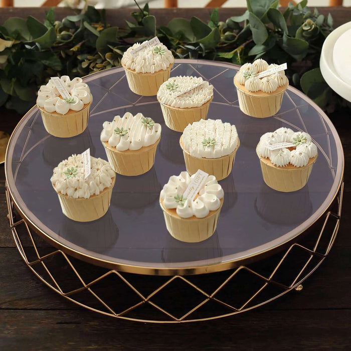 Assorted decorative cupcakes on a stylish cake stand.