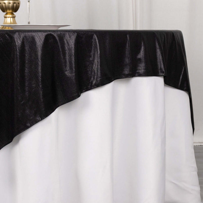 Black tablecloth draping elegantly over a white table.