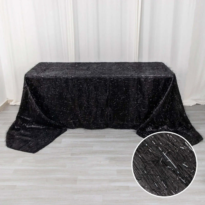 Black tablecloth with sparkling texture, ideal for elegant events.