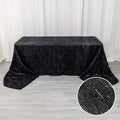 Black tablecloth with sparkling texture, ideal for elegant events.