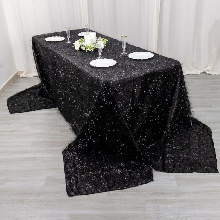 Black tablecloth draped elegantly over a long table for elegant dining.