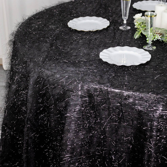 Elegant black tablecloth with shimmering texture, perfect for special occasions.