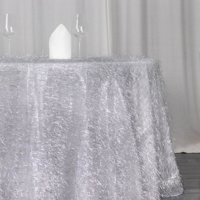 Sparkling silver tablecloth with textured finish, perfect for elegant dining setups.