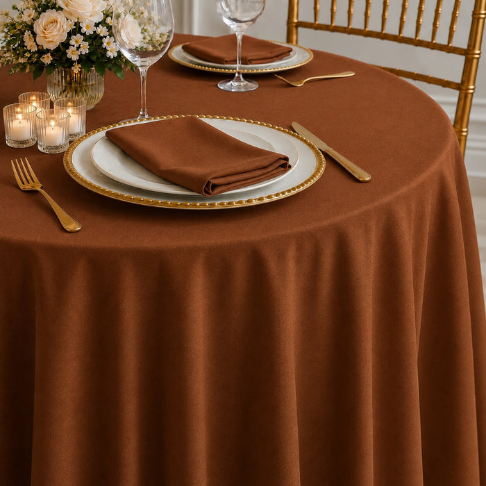 Cinnamon brown seamless round tablecloth on elegantly set dining table