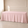 blush rectangle tablecloth on a table