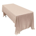 Elegant beige tablecloth draped over a rectangular table.