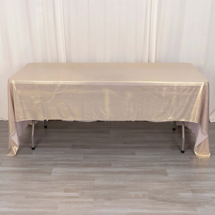 Gold tablecloth draped over a rectangular table in a studio setting.