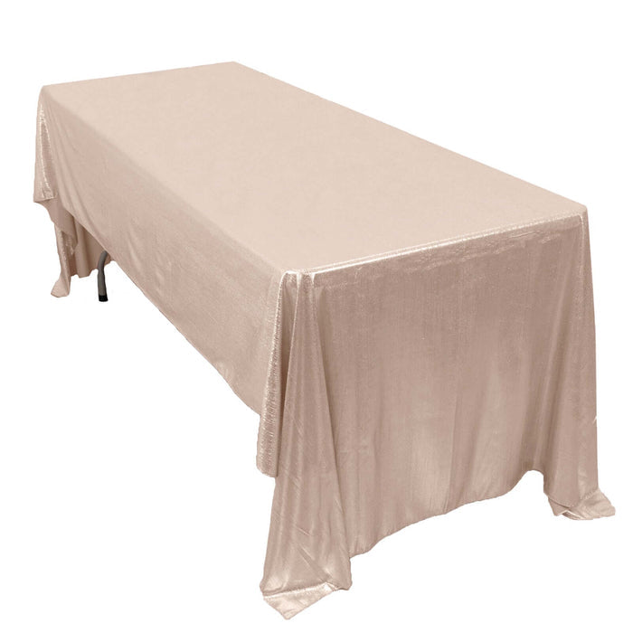 Beige tablecloth draped elegantly over a rectangular table.
